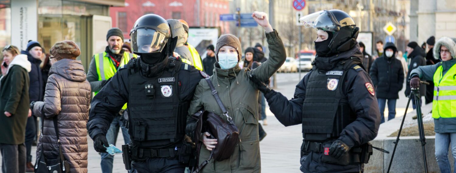 Woman is arrested during a protest in Russia